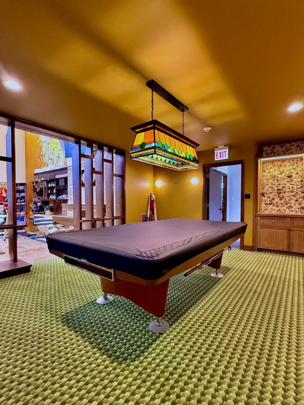 Patterned commercial carpet flooring installed in game room area at Church of Pickleball in Chicago IL